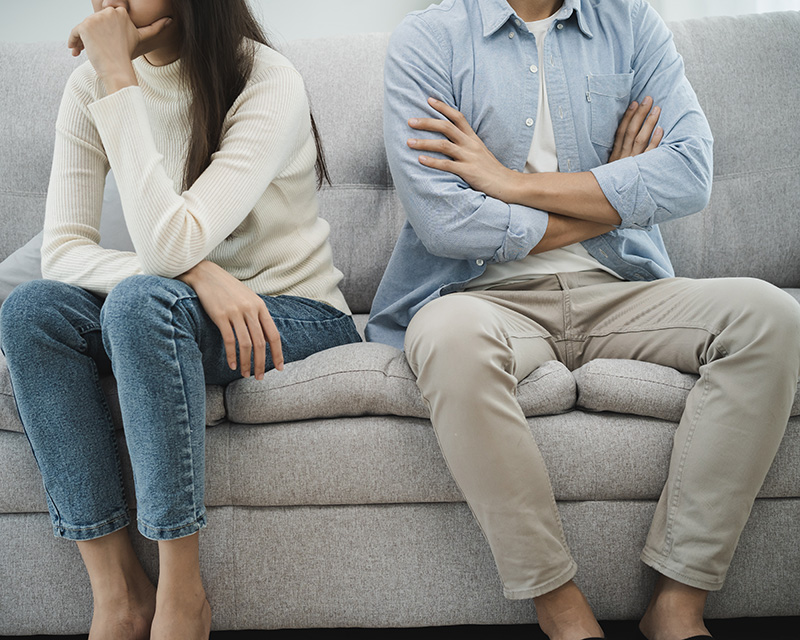 Couple sitting on a couch for sexual addiction treatment